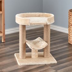 a cat tree in the corner of a room