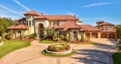 a large house with lots of windows and landscaping