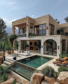 a large house with a swimming pool in front of it