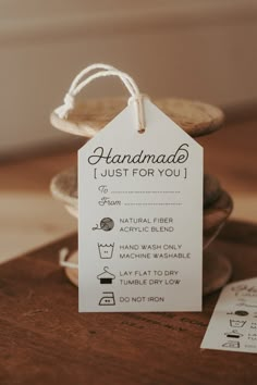 a tag that says handmade just for you next to some cookies on a table