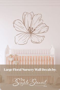 large floral nursery wall decals by the simple pencil company in pink and white with text overlay that reads large floral nursery wall decals by the simple pencil