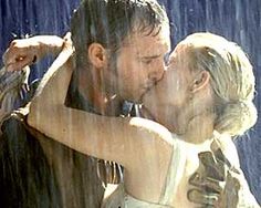 a man and woman kissing in the rain with a quote on it that says, what do you want? to be married to me for