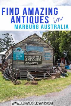 an old wooden building with the words find amazing antiques in blue and green on it