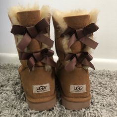 Authentic Women’s Chestnut Ugg’s In The Bailey Bow Style. Cute Silk Satin Ribbon Bow Detail On The Back. The Insides Aren’t Completely Worn. The Front/Inner Sides Have Some Damage/Staining From Winter Snow Weather. If You Know How To Clean Uggs It Could Get Better. There’s Also A Small Spot On The Back Of The Uggs On The Label Inside The “U”. I Will Mail Them With The Box But It No Longer Has The Paper Stuff Inside, It’s Just The Plain Box And Boots. Brand: Ugg Australia Size: Women’s 9 Ugg Long Boots, Ribbon Uggs, Ugh Shoes, Uggs Bow, Cleaning Uggs, Bow Ugg Boots, Cute Boots For Women, Bow Ugg, Bow Uggs