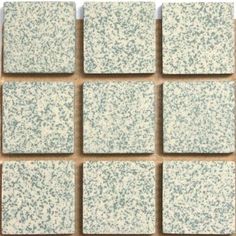 white and blue speckled tile on the wall