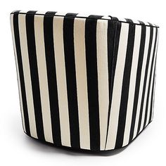 a black and white striped basket sitting on top of a table