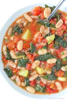 a white bowl filled with bean and vegetable soup