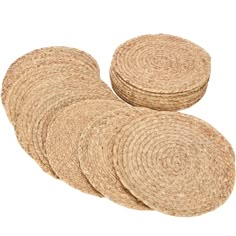 four round straw coasters stacked on top of each other