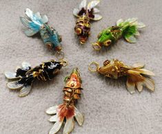 PRICES MAY VARY. Material:brass
 Quantity:5pcs
 Size :approx.35mm 45mm 55mm
 color:mixed color(if want single color,please note it) Articulated Fish, Fish Beads, Bead Diy, Nature Necklace, Earrings Pendant, Handmade Brass, Beaded Skull, Shell Beads, Diy Charms