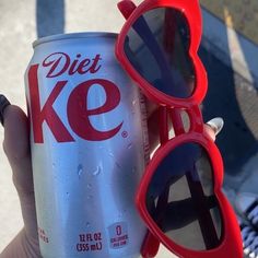 a can of diet coke with sunglasses on it