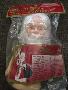 a plastic santa clause head in a package