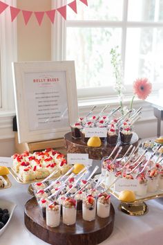 an assortment of desserts are displayed on a table