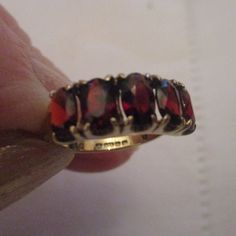 A 9ct Gold Five Stone Vintage  Garnet Ring made in the 1970s.  This is quality Ring , the Five oval deep red oval Garnets are 9ct gold  claw set and are presented on a 9ct gold band. The Garnetsare well matched and have a deep warm colour. Assay mark for Birmingham Uk. Condition Excellent . Size  M. Vintage Garnet Ring, Garnet Ring Vintage, Vintage Clip Earrings, Garnet Gem, Birmingham Uk, Garnet Ring, Red Band, Vintage Clip, Garnet Rings