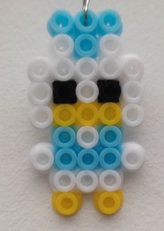 a close up of a cell phone charm made out of legos and plastic rings