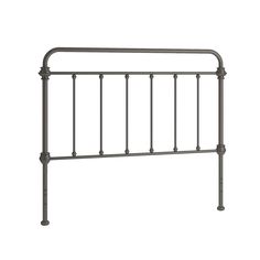 a metal headboard with four posts and an iron design on the top, against a white background