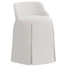 a white chair with pleated skirting on the back and seat, against a white background