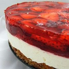 a strawberry cheesecake is shown on a plate