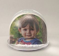 a glass dome with an image of a child in it