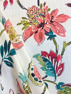 an image of a floral print fabric with flowers and leaves on white background, closeup