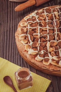 a homemade cinnamon roll pizza on a wooden table