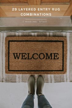 someone standing in front of a welcome mat