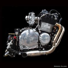 an image of a motorcycle engine with chrome parts on it's front wheel rim