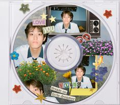 a cd with pictures of young men and flowers on the disc, as well as words that spell out love