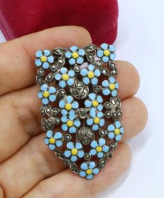 Antique sterling silver marcasite and light blue enamel flower dress clip, In good antique condition, Crica 1900's to 1920's. It's 1"7/8 long 1" wide, Weighs 14 gram, ( the back clip is metal ). Thanks. Dress Clips, Sterling Silver Marcasite, Dress Clip, Flower Dress, Enamel Flower, Shoe Clips, Flower Dresses, Wedding Shop, Halloween Shopping