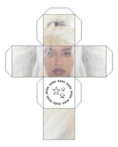 a paper cross with an image of a woman's face