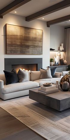 a living room filled with furniture and a large painting on the wall above it's fireplace