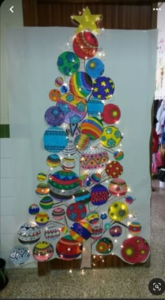 a christmas tree made out of plates and lights