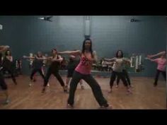 a group of young women dancing in a gym