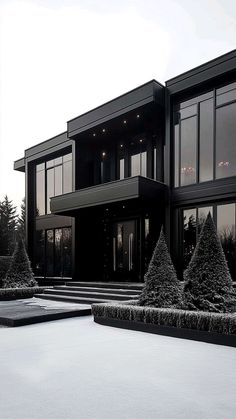 a black and white photo of a modern house