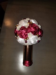 a bridal bouquet with red and white flowers