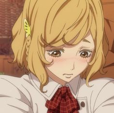 an anime character with blonde hair wearing a white shirt and red bow around her neck