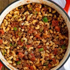 a pot filled with pasta and ground beef