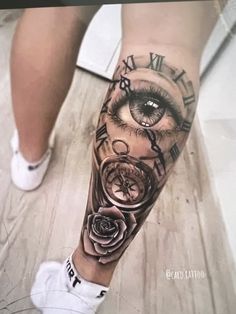 a person with a clock and rose tattoo on their leg