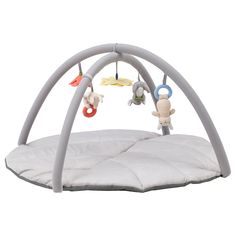 a baby's play gym with toys hanging from it