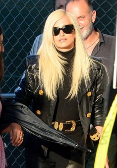 lady in black leather jacket and sunglasses on the street