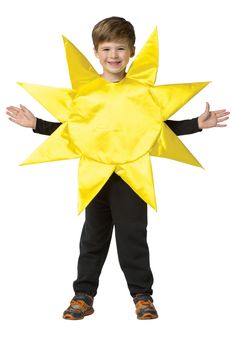 a young boy wearing a yellow star costume