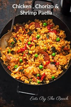 chicken, chorizo and shrimp paella in a skillet