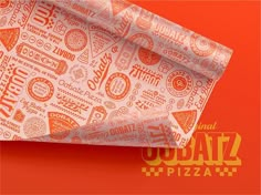 an orange and white pizza wrapper on top of a red background with the words urban pizza written across it