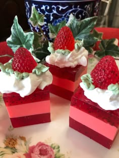 strawberry shortcakes with whipped cream and strawberries on top are sitting on a plate