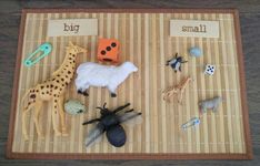 a bamboo mat topped with different types of toys and animals on top of each other