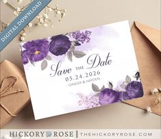 save the date card with purple flowers and leaves on it next to some gift boxes