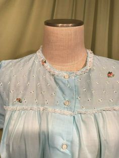 "This is a pretty pajama set from the 60s. Labeled, \"Katz\". Tagged a size 36, bust measures 42\", see measurements below. The set is made of light blue cotton blend. The long pants have elastic waist. The top has lace trim & appliqued flowers on the eyelet bodice with 5 buttons down the front. It has short sleeves & a smock shape. Condition is very good. I believe this is new, old stock, as the labels look like they were never laundered, still crisp! No wear, soil, or stains. Lovely! M Light Blue Cotton Sleepwear, Light Blue Cotton Sleepwear For Home, Blue Cotton Sleepwear With Lace Trim, Retro Nightgown For Sleepovers, Vintage Long Sleeve Cotton Sleepwear, Vintage Long Sleeve Daywear Sets, Vintage Sets For Spring Daywear, Retro Long Sleeve Cotton Sleepwear, Vintage Spring Pajama Party Sets