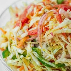 a salad in a glass bowl on a table