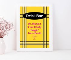 a yellow and pink poster with the words drink bar on it next to a white vase