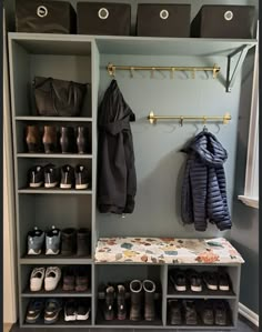 an organized closet with shoes and coats