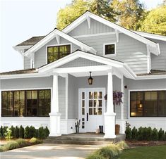 the front view of a house with white trim